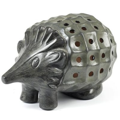 Terra Cotta Trends - Luminary Hedgehog Our hedgehog luminary is handmade of red clay terra cotta from the Baja region of Mexico. Sun-dried and oven-fired. This durable attractive luminary is suitable for either indoor or outdoor use. To illuminate simply insert a candle, battery or electric powered light (not included). Color: Slate (Grey Green)